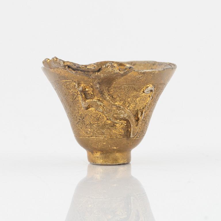 A gilt bronze libation cup, China, presumably 20th Century.