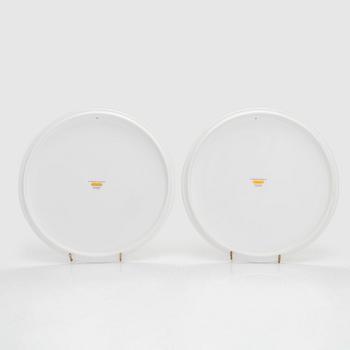 Cartier, two 'La Maison des Must' porcelain cake dishes.