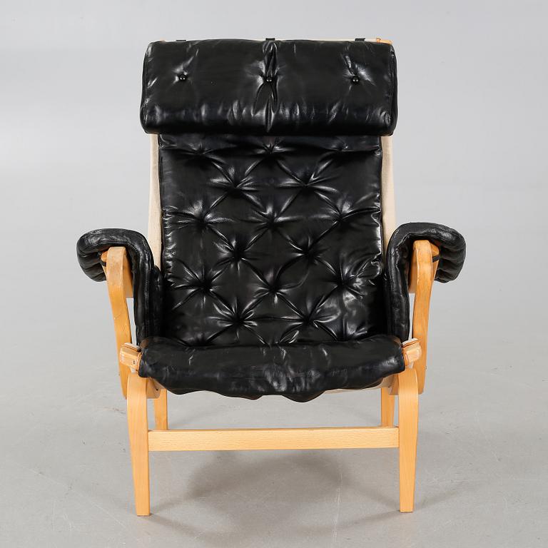 A 20th century "Pernilla" armchair, designed by Bruno Mathsson for DUX.