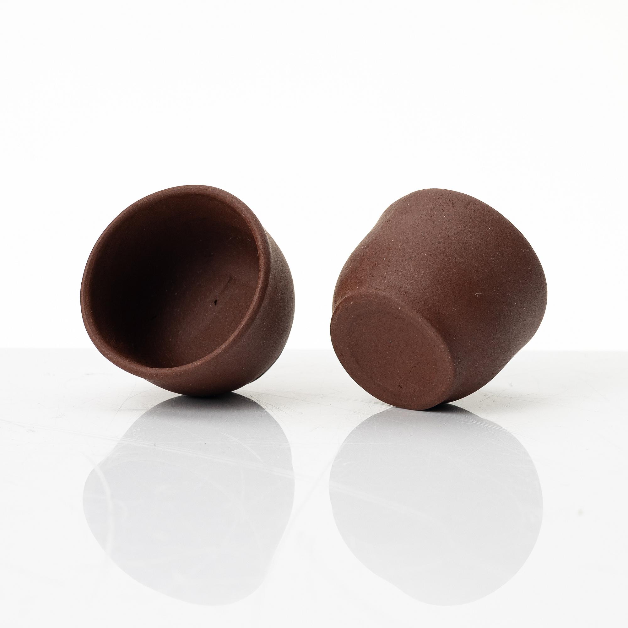 Wu Quan Xiang, A Chinese yixing teapot and a bowl with sieve and four cups, 1980s.