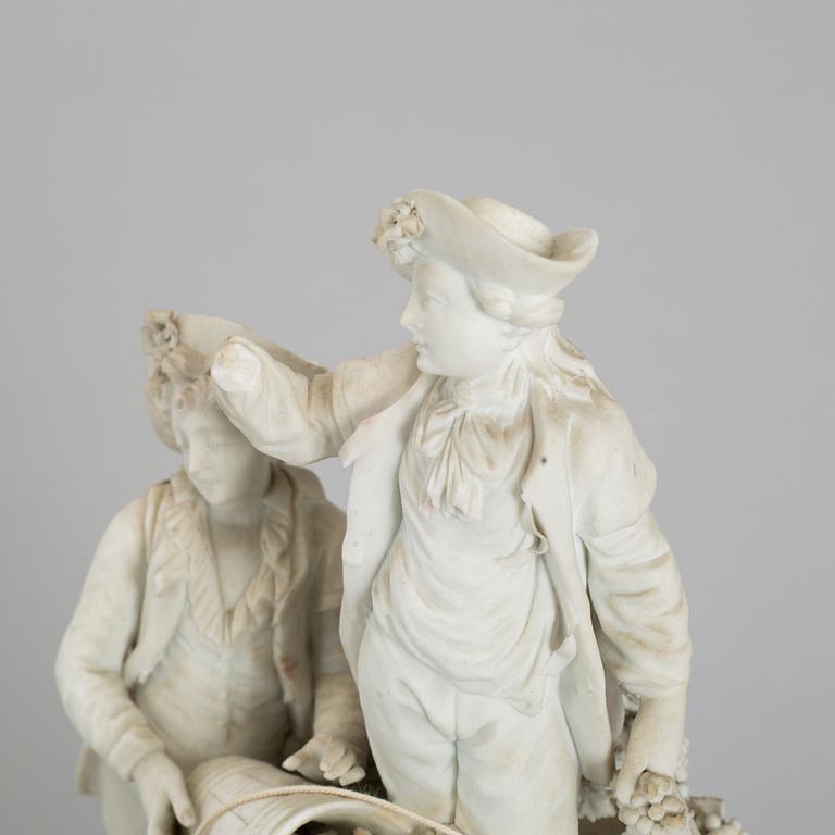 A biscuit porcelain figure group, circa 1900.