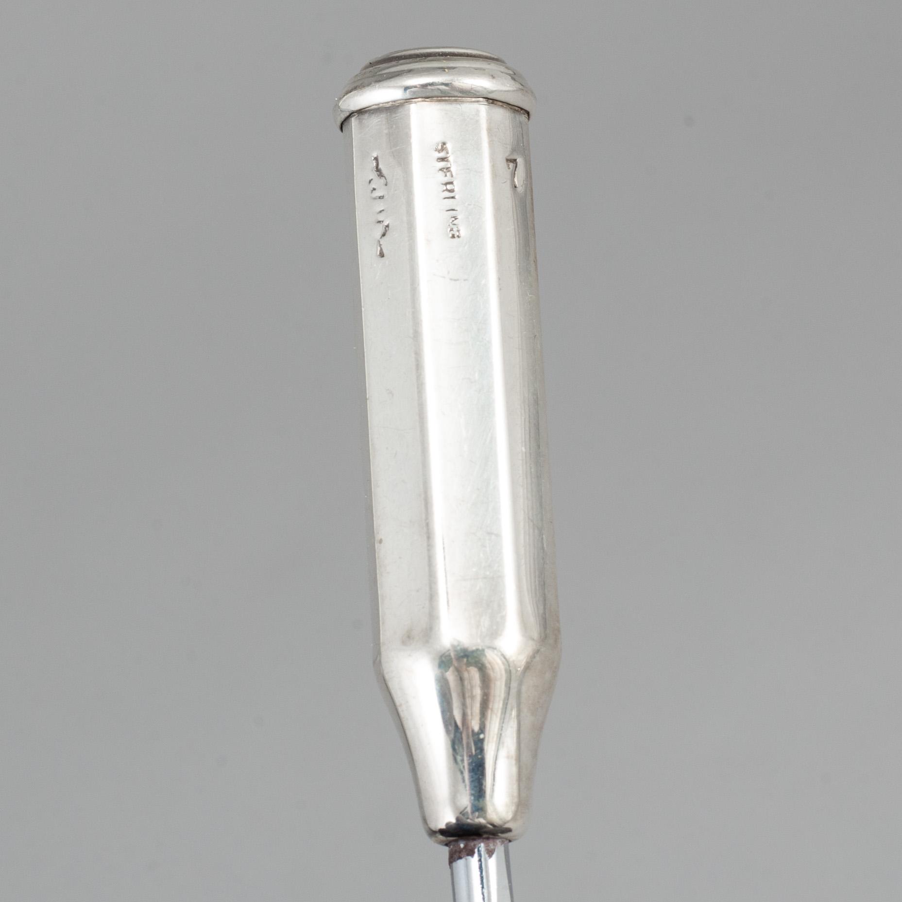A set of seven con cob forks, sterling.