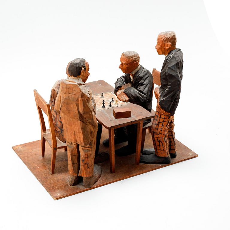 AXEL PETERSSON DÖDERHULTARN, sculpture group, partially painted carved wood, Chess players, stamp signed.