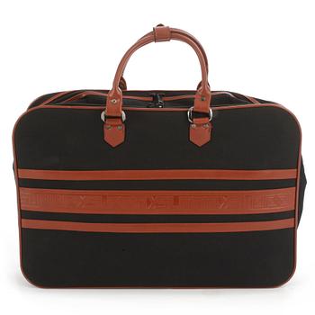 YVES SAINT LAURENT, a black canvas and brown leather suitcase.