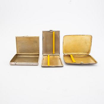 A set of three different 20th century silver cigarette cases, weight in total 456 grams.