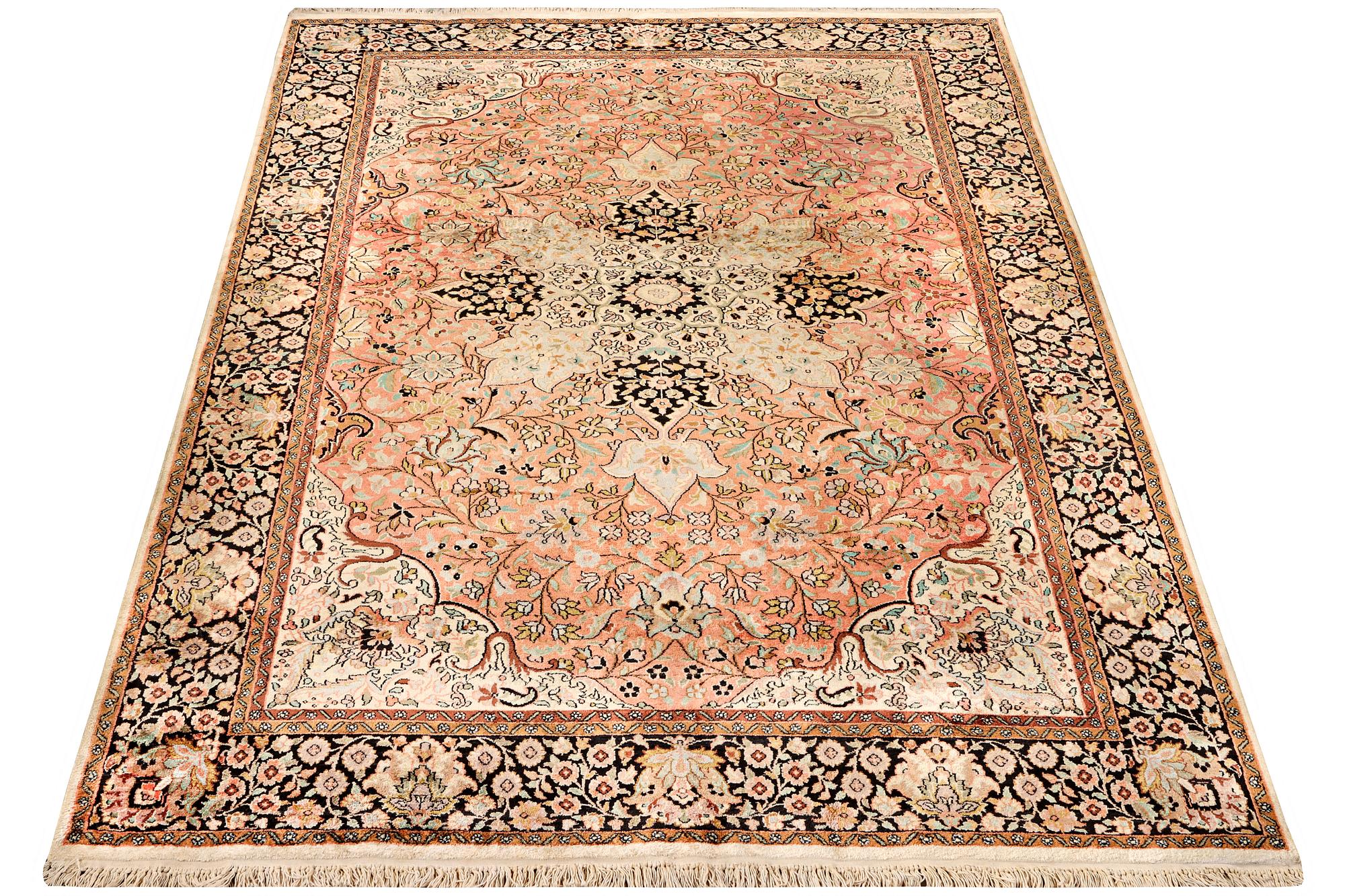 A silk Kashmar carpet, c. 280 x 177 cm.