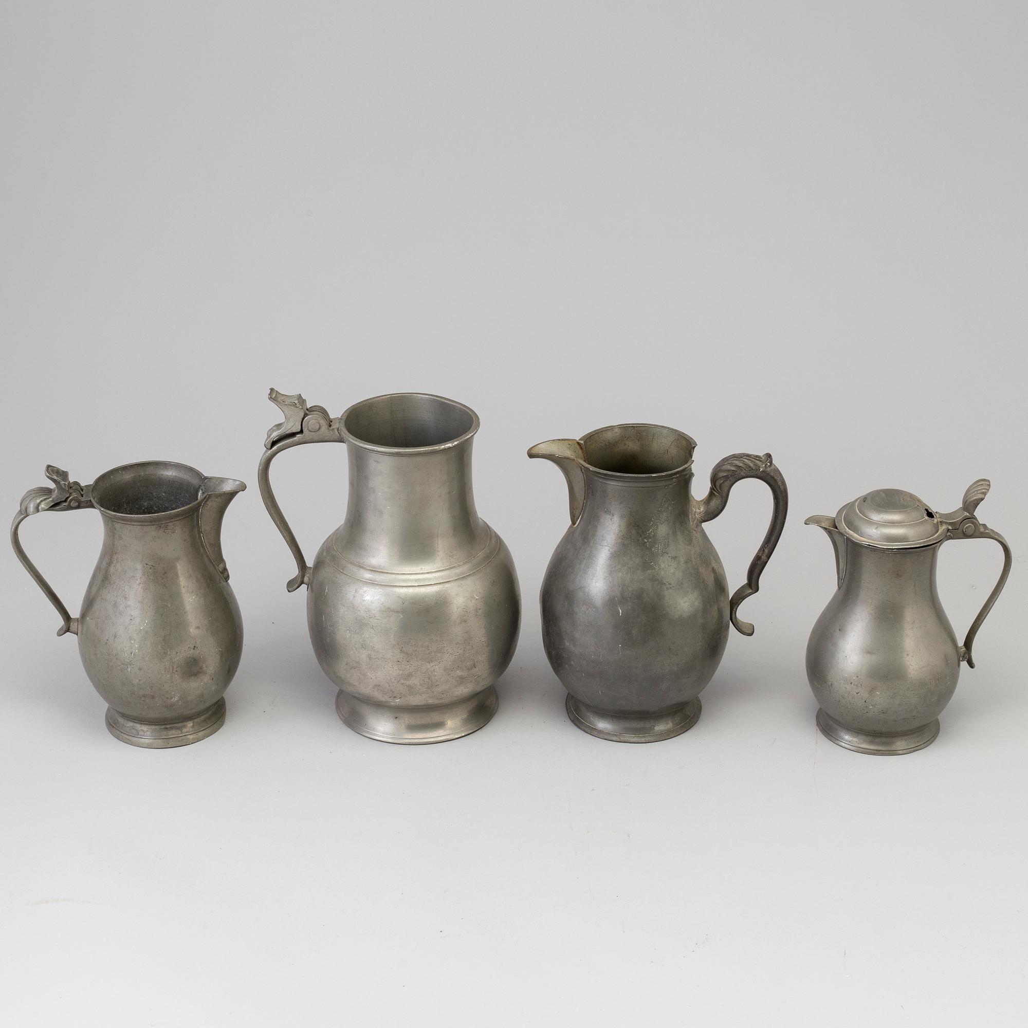 Four 18th century pewter jugs.