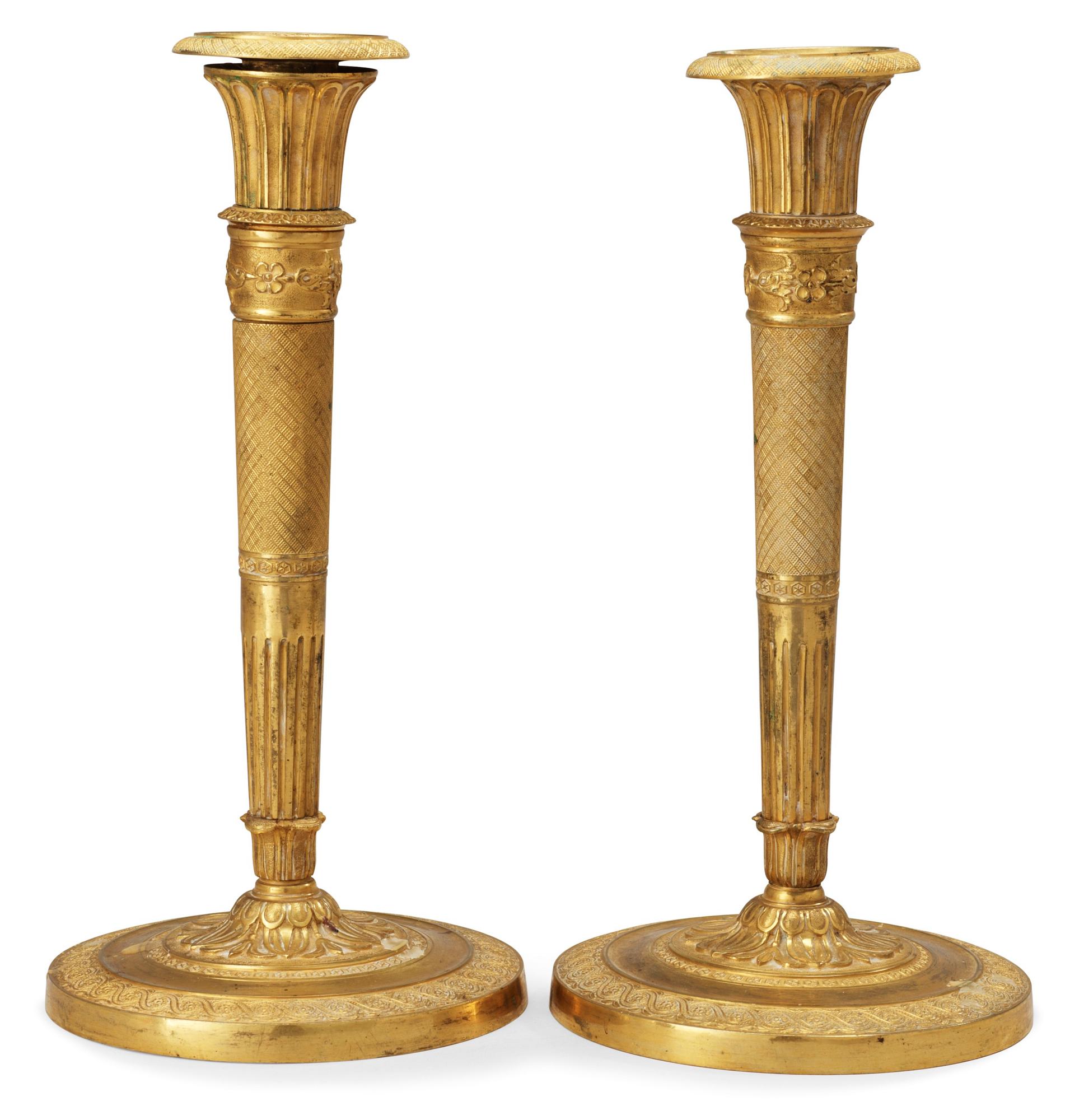 A pair of French Empire early 19th century candlesticks.