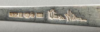 A Swedish 20th century sterling set of three sandwich spoons ad a beaker mark of W Nilsson Lund 1965, 1967 and 1946,