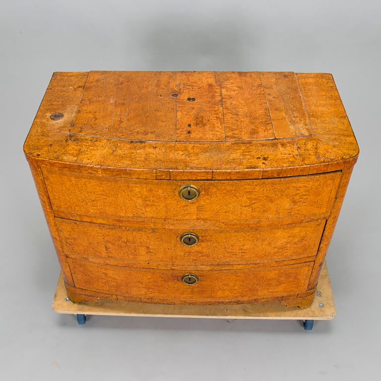 A bureau veneered in Karelian birch, mid-19th century.