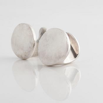 A pair of cufflink, by Ole Lynggaard.