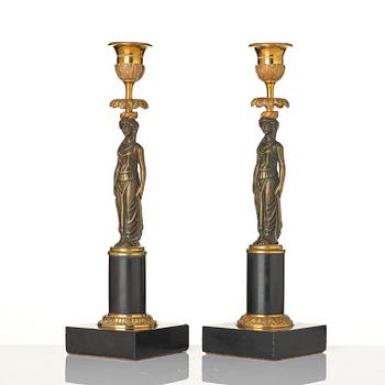 A pair of late Gustavian marble and ormolu candlesticks in the manner of F. L. Rung (1758-1837).