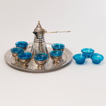 A 1970s Egyptian coffee set in silver and glass.