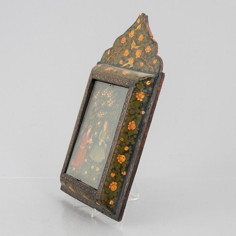 A figure scene in a richly decorated frame, Persia, first half of the 20th century.