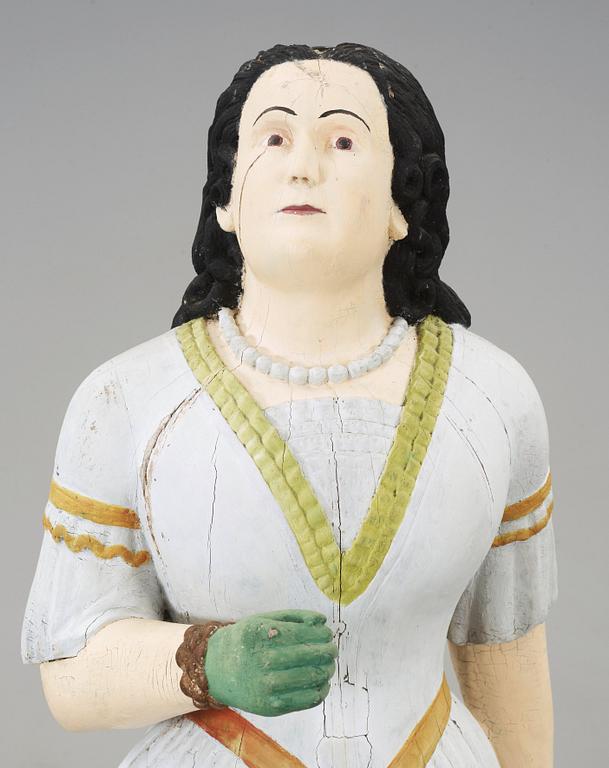 A 19th century wooden figure-head.