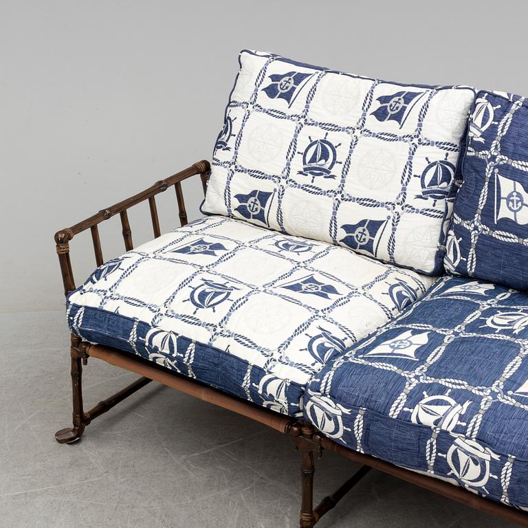 A contemporary bamboo imitating garden sofa.
