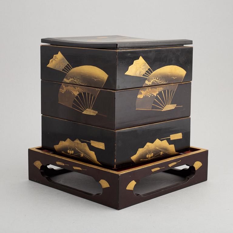 A Japanese lacquer three-tier 'Jubako' (food container) with stand, presumably early 20th century.