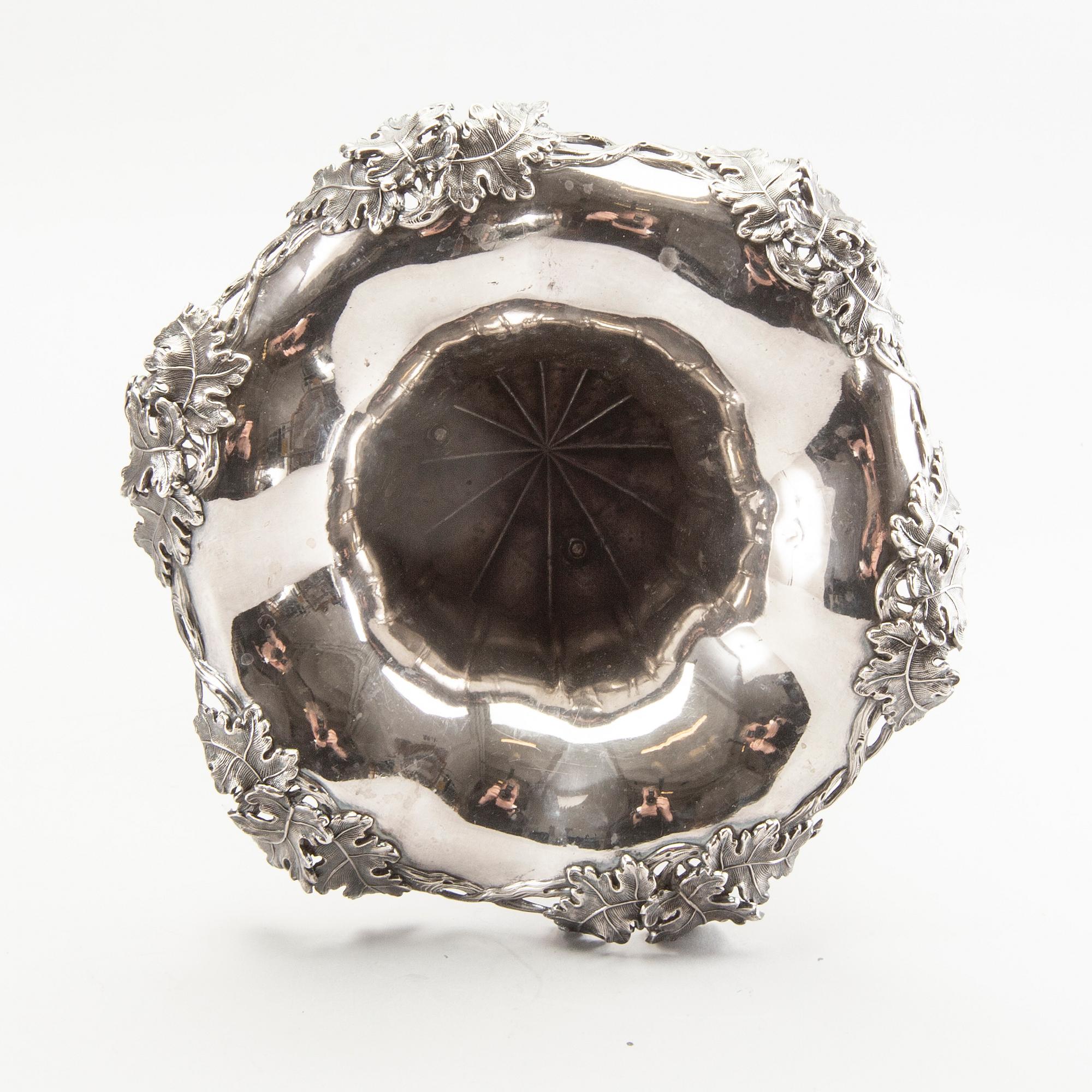 A silver wine cooler/vase by Gustaf Möllenborg, Stockholm 1869.