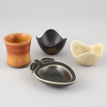 Gunnar Nylund, a stoneware wall relief, three bowls, a vase and an ashtray, Rörstrand.