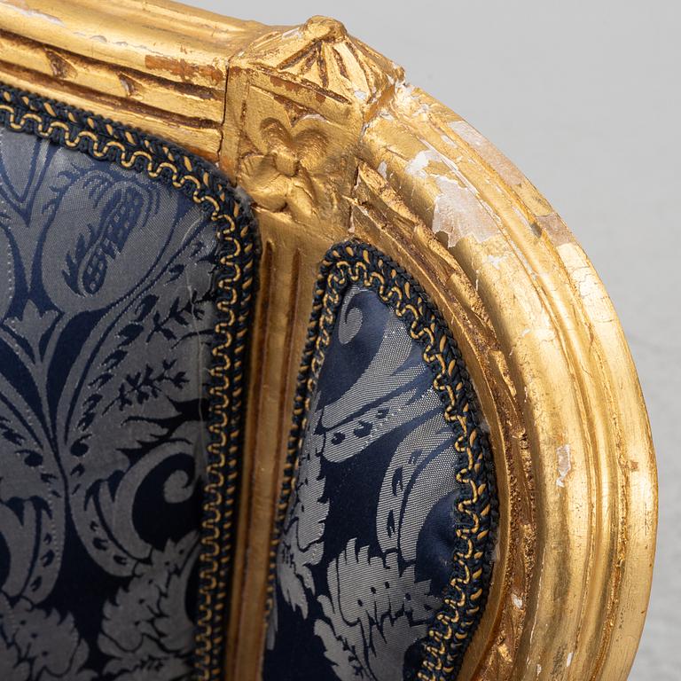 A pair of Louis XVI style armchairs, late 20th Century.