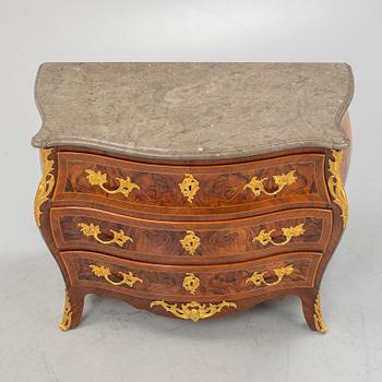 A Swedish rococo parquetry and gilt-bronze mounted commode in the manner of C. W. Hein, later part of the 18th century.