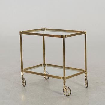 A BRASS SERVING TROLLEY.