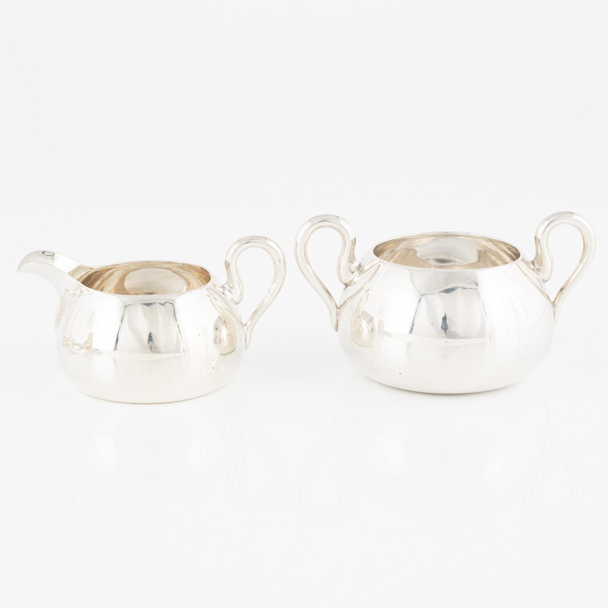 Enamel spoons, 6 pcs, sugar bowl and creamer, and two tongs, silver.