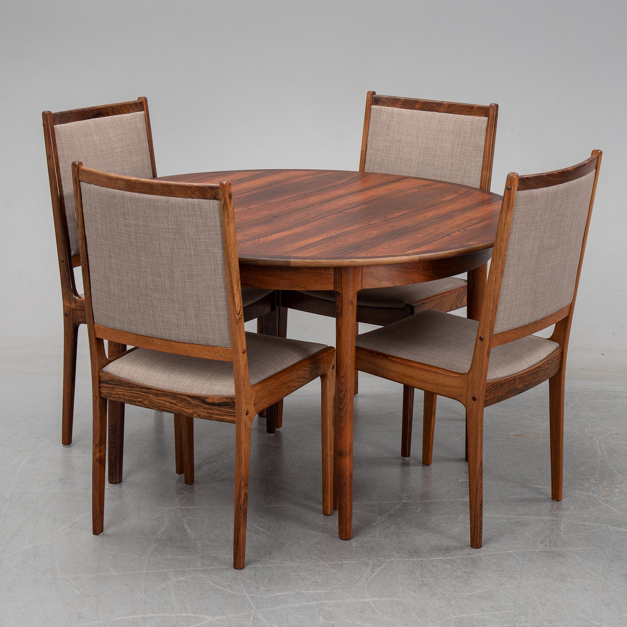 A seven-piece rosewood dining suite, 1960's/70's.