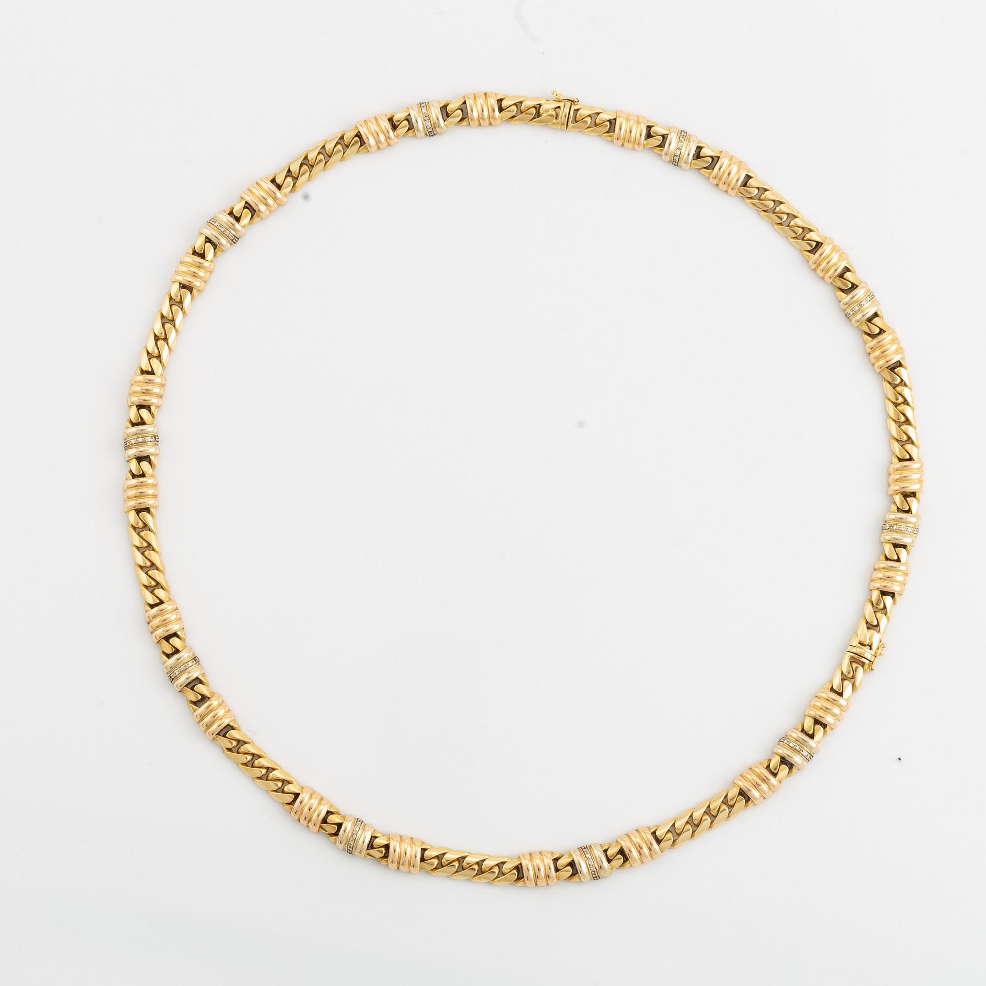 An 18K gold necklace/bracelet combination set with brilliant-cut diamonds.
