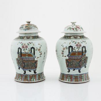 A pair of Chinese lidded urns, late Qing dynasty, around the year 1900.