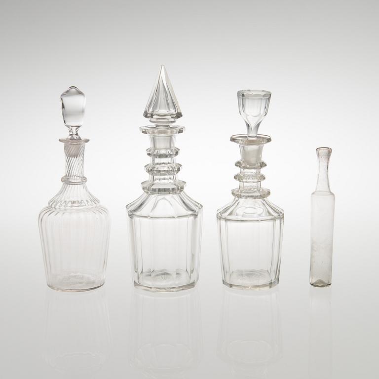 Three carafes and a glass bottle from the end of the 19th century.