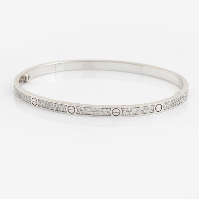 A Cartier "Love" bracelet small model in 18K white gold with round brilliant-cut diamonds.