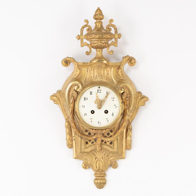 A bronze wall clock, Louis XVI style, France, circa 1900.