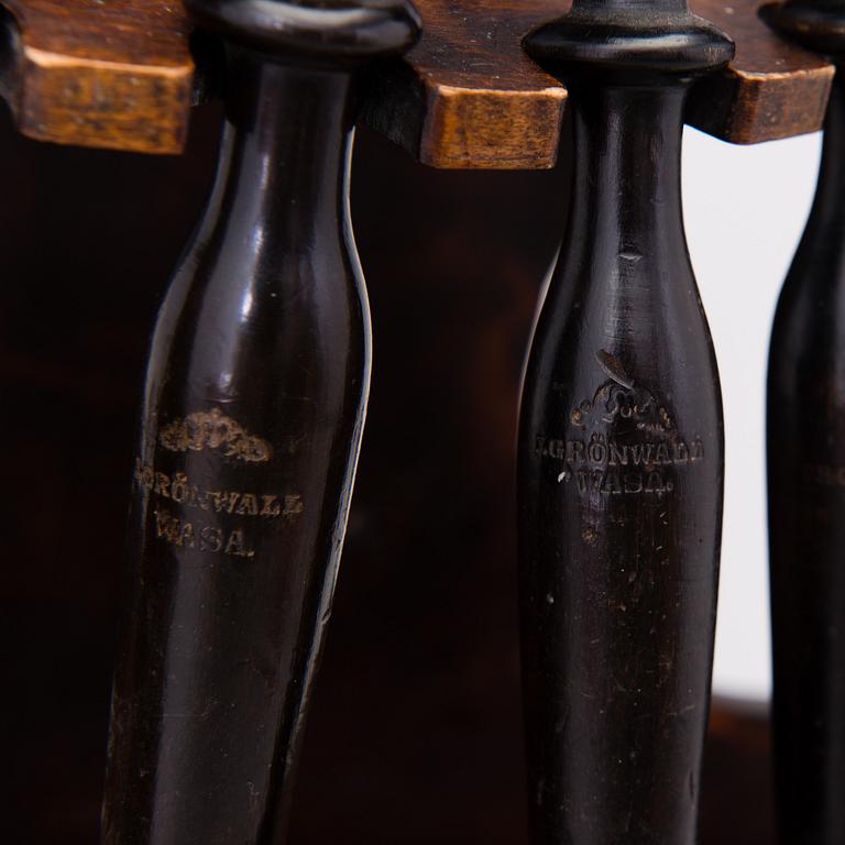 19th century pipes on a wooden pipe rack.