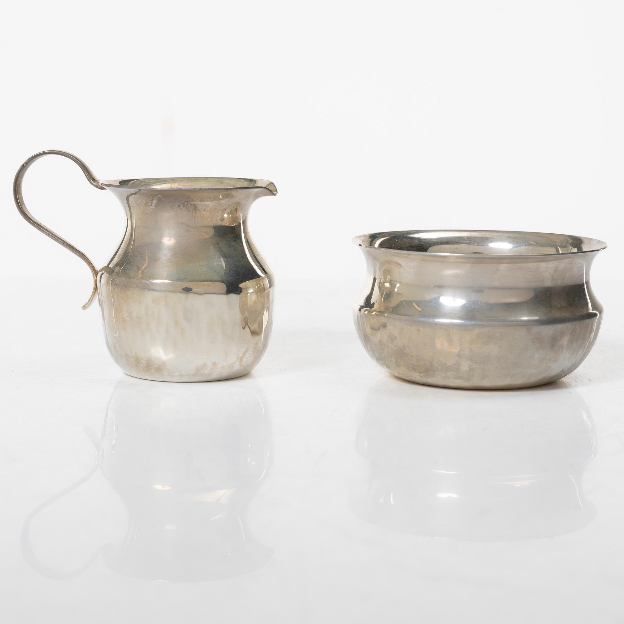 a silver creamer and sugar bowl, designed by Christian, Gewe Silvervarufabriken Ab, Malmö, Sweden, 1974-75.