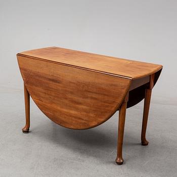 An end of the 19th Century mahogany drop leaf table.