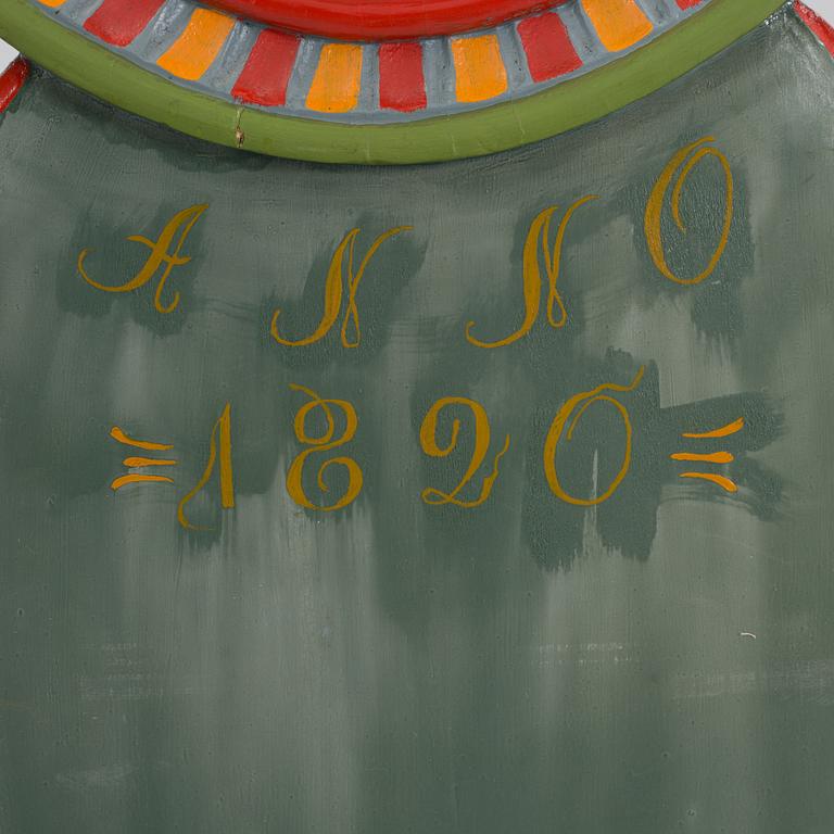 a painted grandfather-clock from the first half of the 19th century.