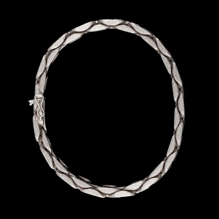 A white gold bracelet.