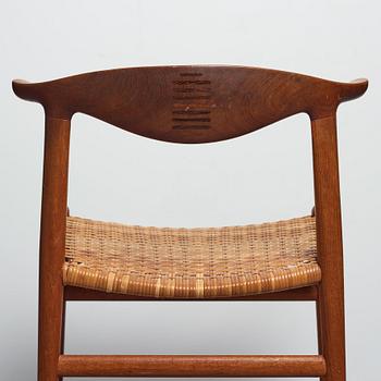 Hans J. Wegner, a set of six teak and rattan "Cowhorn Chairs" "JH-505", executed by cabinetmaker Johannes Hansen, Denmark 1950-60's.