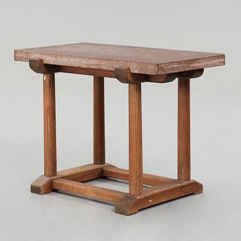 Axel Einar Hjorth, a red limestone top and stained pine side table, Nordiska Kompaniet, Sweden 1929.