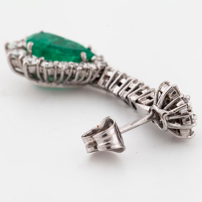 A pair of pear cut emerald and brilliant cut diamond earrings.