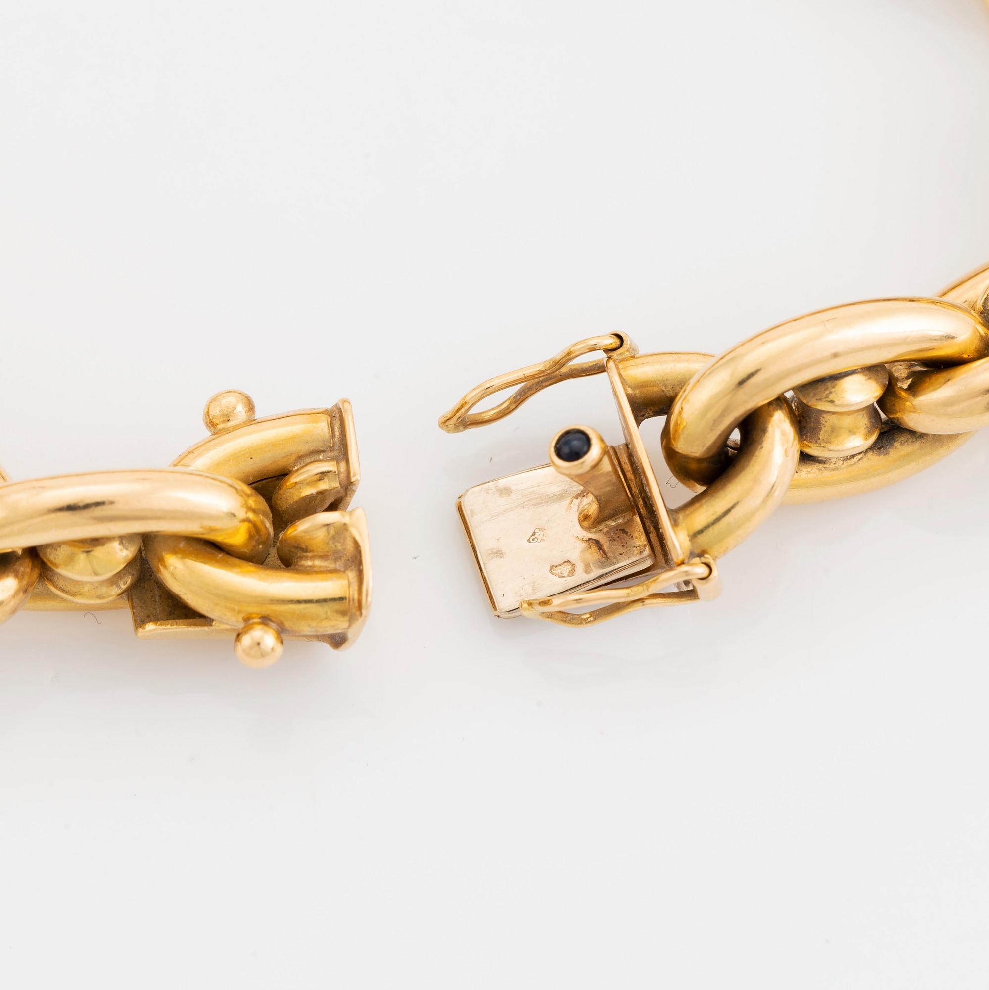An 18K gold bracelet.