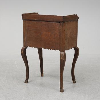 A mid 18th Century oak rococo bedside table.