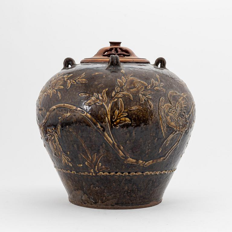 A large brown glazed marthaban jar, presumably late Ming dynasty (1368-1644).