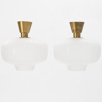A pair of glass and brass Swedish Modern ceiling lights, Böhlmarks, 1940's.