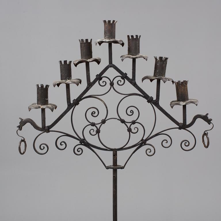 A metal floor candelabra, first half of the 20th century.