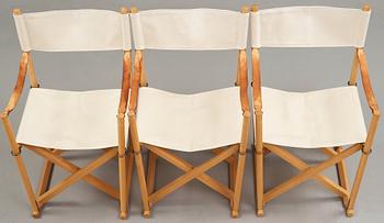 Mogens Koch, a set of six beech and canvas 'MK16' folding chairs, comes with a stand for storage, Rud Rasmussen, Denmark.