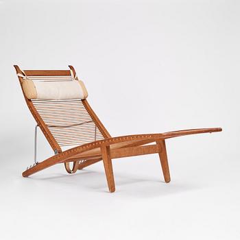 Hans J. Wegner, an oak lounge chair model "JH 524", Johannes Hansen, Copenhagen.