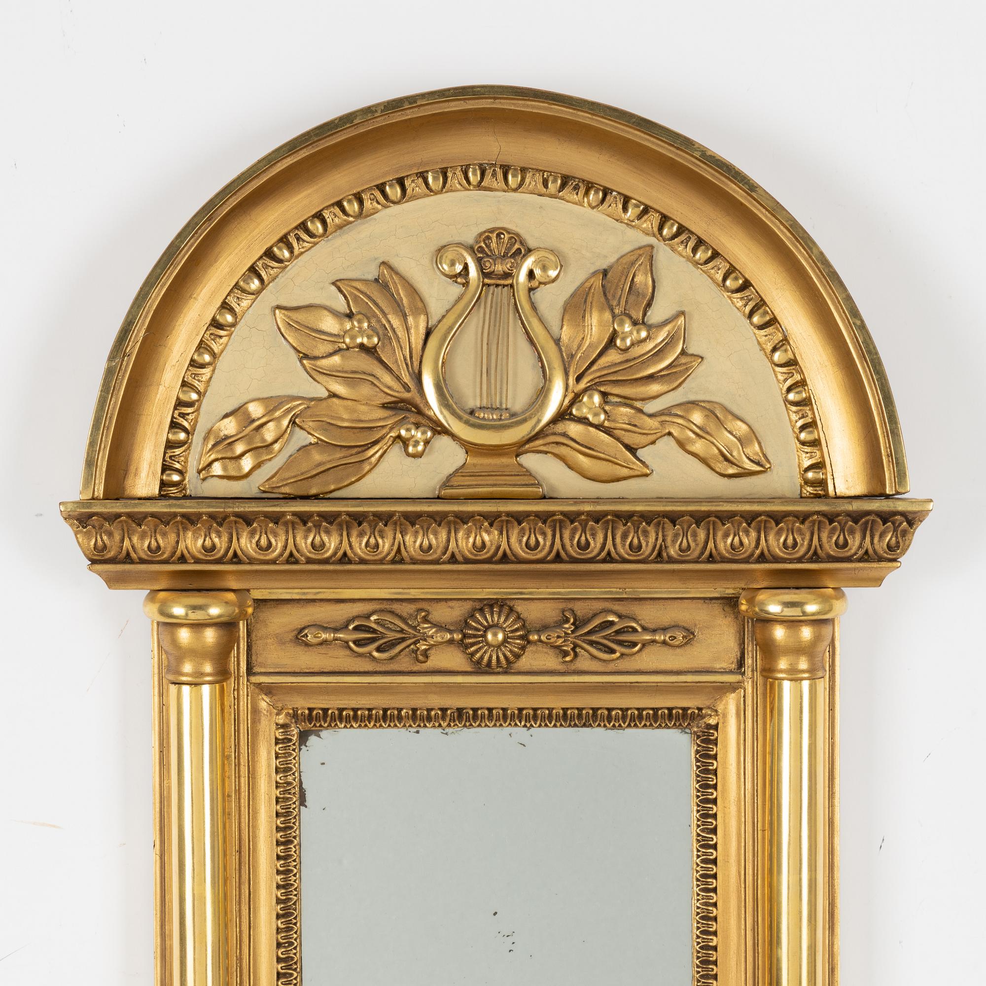 An Empire mirror, first half of the 19th century.