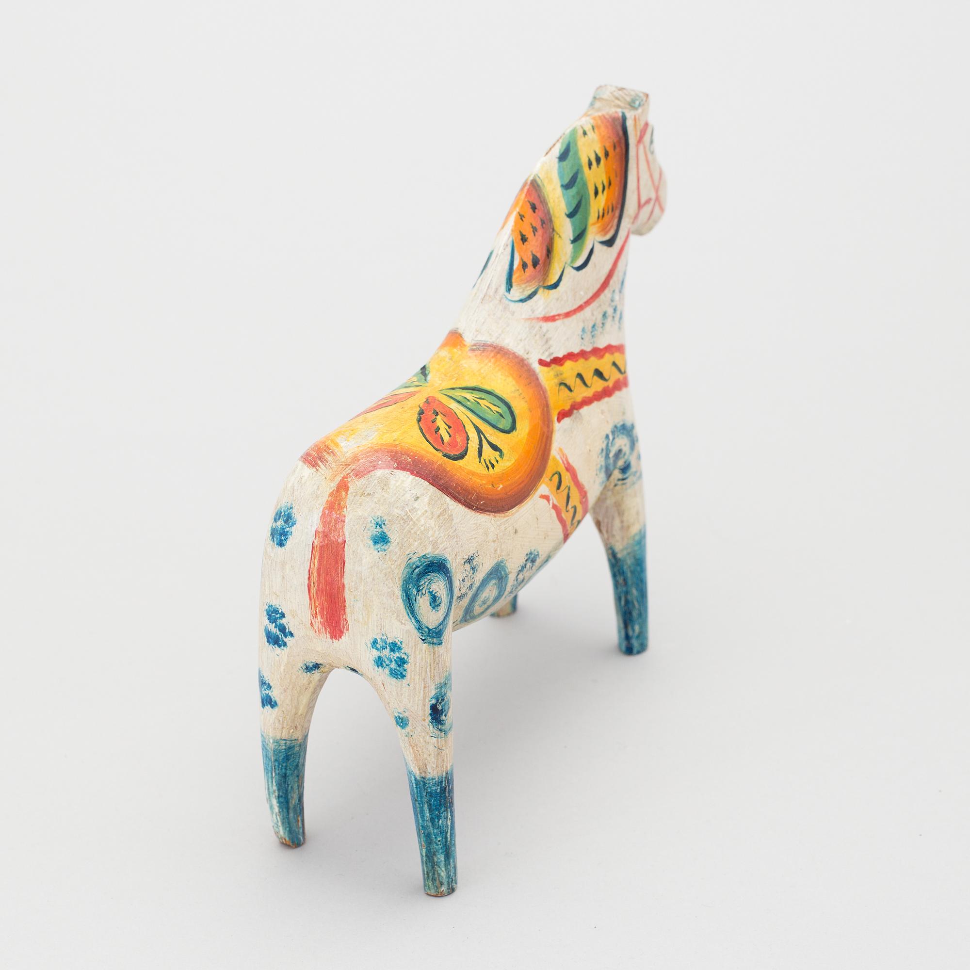 A painted folk art dala horse first half of the 20th century.